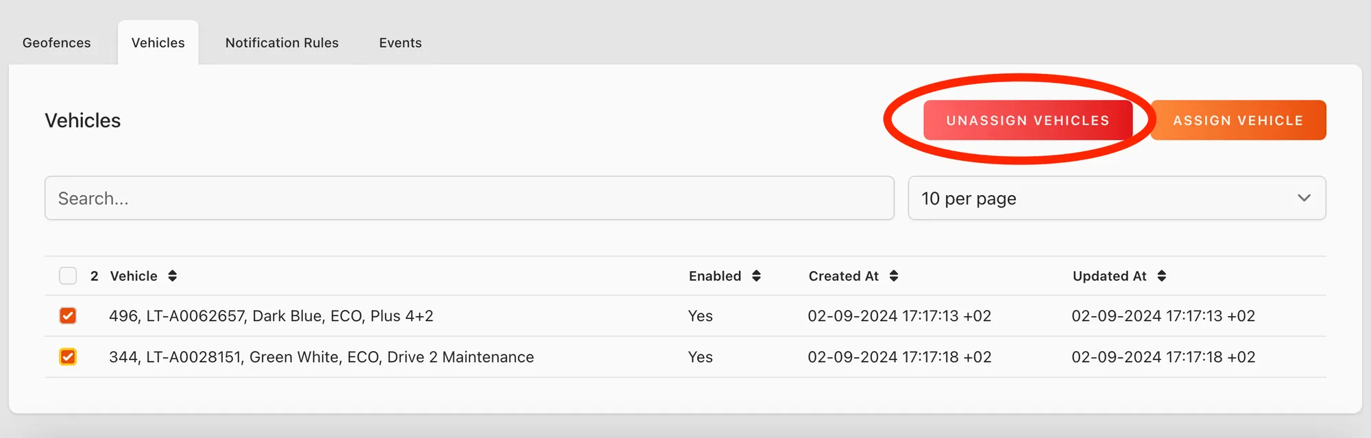 Web app: Vehicles tab with two vehicles selected and the Unassign Vehicles button circled